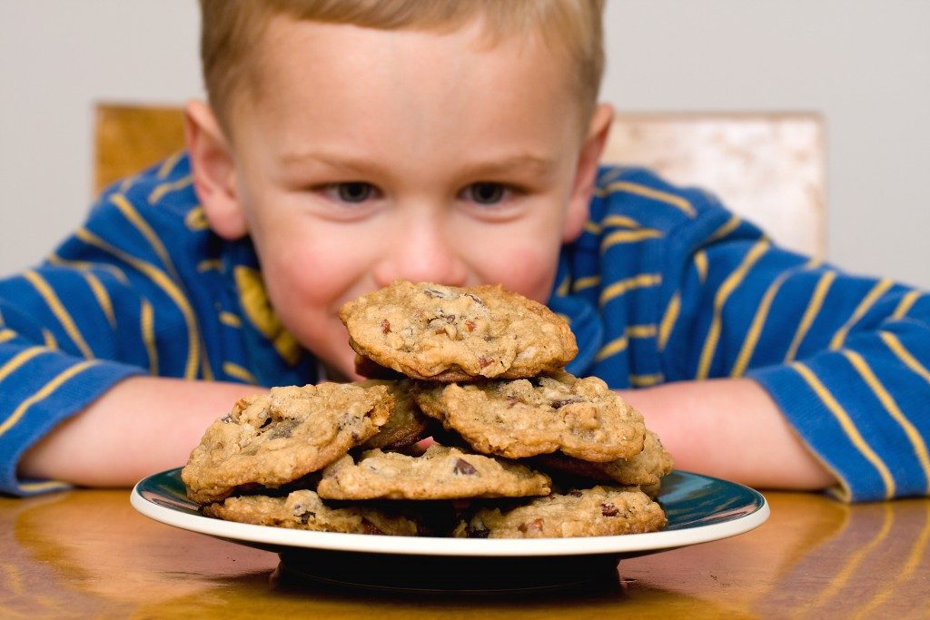 Kid looking at the cookies