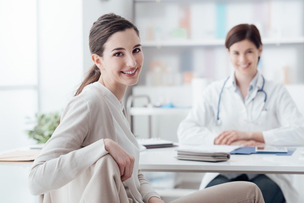 Patient smiling with her doctor