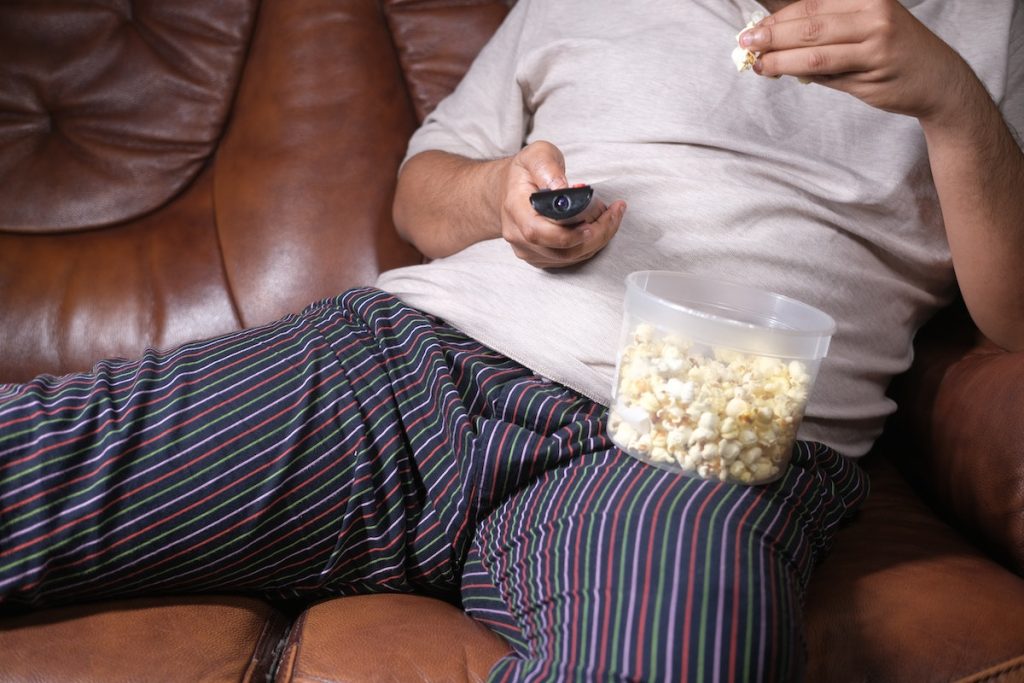 man eating popcorn